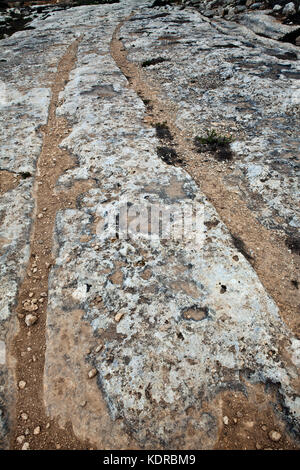 Cart Ruts are found at various places around the Maltese islands.  They are normally found as a complex network of tracks gouged in the rock and their Stock Photo