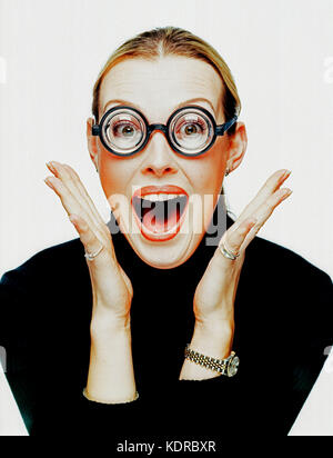 Young woman. Studio portrait. Thick lense spectacles. Stock Photo