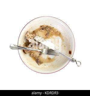 An empty plate, dirty after the meal is finished. Overhead View on a white background Stock Photo