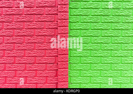 Wall brick mold slats closeup pastel colors  lime green and red paint detail texture full frame background. Stock Photo
