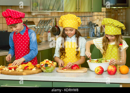 Children making salad. Stock Photo