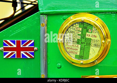 British racing green Vintage Morgan 3 wheeler car tax licence details Stock Photo