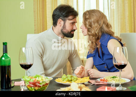 Romantic couple eating spaghetti. Stock Photo