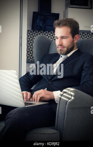 Young business man working from home with laptop. home computer businessman laptop concept Stock Photo