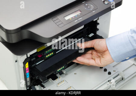 Man replacing toner in laser printer. toner printer cartridge print laser office supplies refill concept Stock Photo