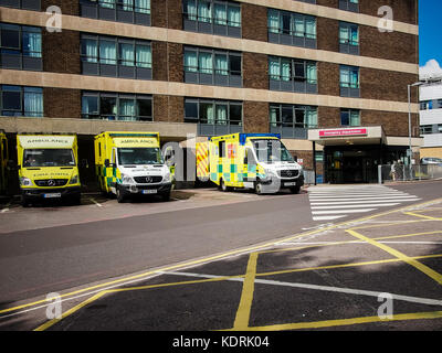 Ambulances parked outside the Queen Alexandra hospital, accident and emergency department, Portsmouth, Hampshire. Stock Photo
