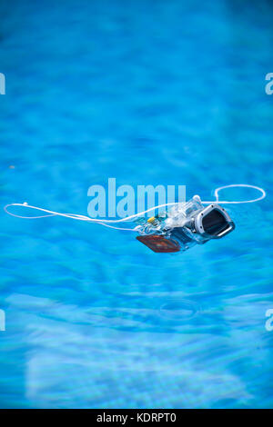 Underwater photo camera housing floating in a swimming pool Stock Photo