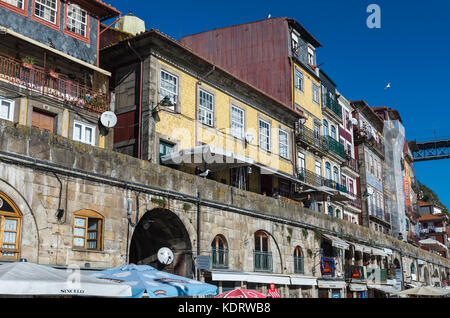 Residential buildings on a Cais da Ribeira street riverfront, Ribeira district in Porto city, second largest city in Portugal Stock Photo