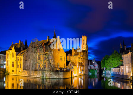 Bruges, Belgium - April 17, 2017: View from the Rozenhoedkaai of the Old Town of Bruges at dusk, Belgium Stock Photo