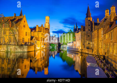 Bruges, Belgium - April 17, 2017: View from the Rozenhoedkaai of the Old Town of Bruges at dusk, Belgium Stock Photo