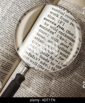 Magnifying Glass Focused On The Word Success In A Vintage Dictionary Stock Photo
