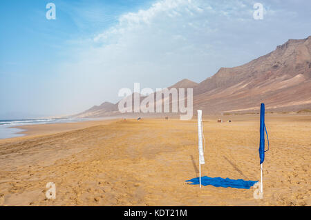 folded sunshade at Cofete beach, Jandia Peninsula, Fuerteventura, Canary Islands, Spain Stock Photo