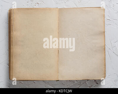 Open book blank on white concrete background Stock Photo