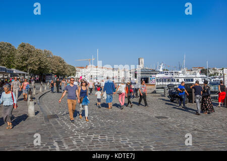 Holidaymakers walking around the Old Port, La Rochelle, France. Stock Photo