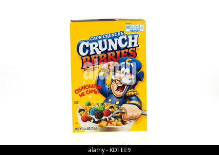 An unopened box of Cap'n Crunch sweetened corn and oat cereal on white ...