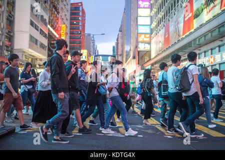 Mong Kok, Kowloon, Hong Kong - OCTOBER 14, 2017 : Unidentified people on the Argyle Street and Nathan Road crossing in Mong Kok, Kowloon, Hong Kong . Stock Photo