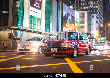 Mong Kok, Kowloon, Hong Kong - OCTOBER 14, 2017 : Public modes of transportation on the Argyle Street and Nathan Road crossing in Mong Kok, Hong Kong. Stock Photo