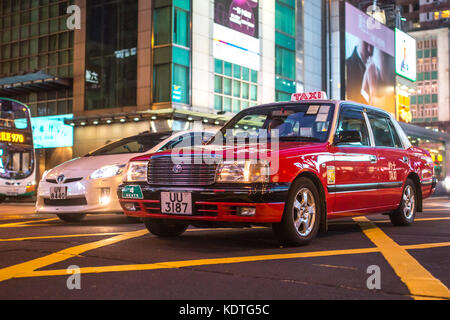 Mong Kok, Kowloon, Hong Kong - OCTOBER 14, 2017 : Public modes of transportation on the Argyle Street and Nathan Road crossing in Mong Kok, Hong Kong. Stock Photo