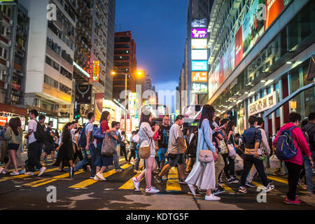 Mong Kok, Kowloon, Hong Kong - OCTOBER 14, 2017 : Unidentified people on the Argyle Street and Nathan Road crossing in Mong Kok, Kowloon, Hong Kong . Stock Photo