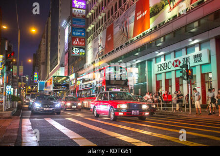 Mong Kok, Kowloon, Hong Kong - OCTOBER 14, 2017 : Public modes of transportation on the Argyle Street and Nathan Road crossing in Mong Kok, Hong Kong. Stock Photo