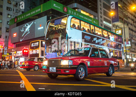 Mong Kok, Kowloon, Hong Kong - OCTOBER 14, 2017 : Public modes of transportation on the Argyle Street and Nathan Road crossing in Mong Kok, Hong Kong. Stock Photo