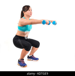 asian chubby woman holding dumbbell for exercising Stock Photo