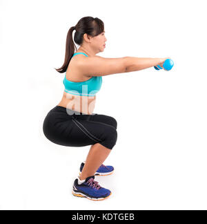 asian chubby woman holding dumbbell for exercising Stock Photo