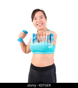 asian chubby woman holding dumbbell for exercising Stock Photo