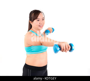 asian chubby woman holding dumbbell for exercising Stock Photo