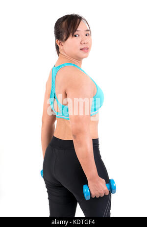 asian chubby woman holding dumbbell for exercising Stock Photo