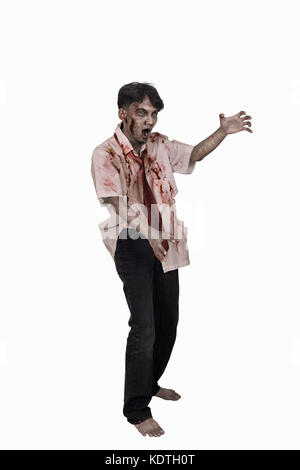 Portrait of horrible asian zombie man posing isolated over white background Stock Photo