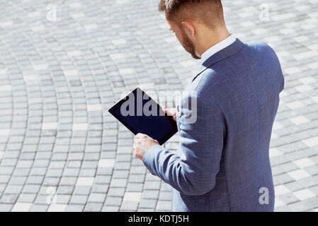 Businessman tablet computer concept outdoors Stock Photo
