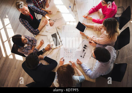 Portrait of young perspective designers having meeting Stock Photo