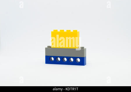 stacked multicolored toy brick/plastic block isolated on a white background Stock Photo
