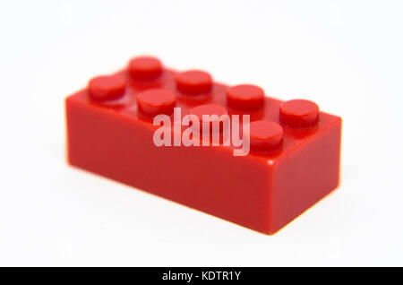 red toy brick/plastic block isolated on a white background Stock Photo