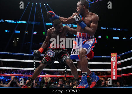 Brooklyn, New York, USA. 15th Oct, 2017. ERISLANDY LARA (red, white, and blue trunks) and TERRELL GAUSHA battle in a Super WBA/IBO Super Welterweight World Championship bout at the Barclays Center in Brooklyn, New York. Credit: Joel Plummer/ZUMA Wire/Alamy Live News Stock Photo