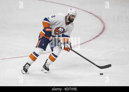 New York Islanders defenseman Nick Leddy (2) pulls the jersey of  Philadelphia Flyers center Kevin Hayes (13) in the first period of an NHL  hockey game Saturday, March 20, 2021, in Uniondale