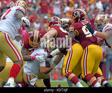 Dec. 24, 2011 - Landover, Maryland, U.S - Minnesota Vikings running back  Adrian Peterson (28) fights to break a tackle by Washington Redskins  outside linebacker Brian Orakpo (98) during Saturday afternoon's game