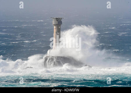 Lands End, Cornwall, UK. 16th Oct, 2017. UK Weather. Gale force winds from ex hurricane Ophelia whips up huge stormy seas which spectacularly crash against the Longships Lighthouse off the coast of Lands End in Cornwall. Photo Credit: Graham Hunt/Alamy Live News