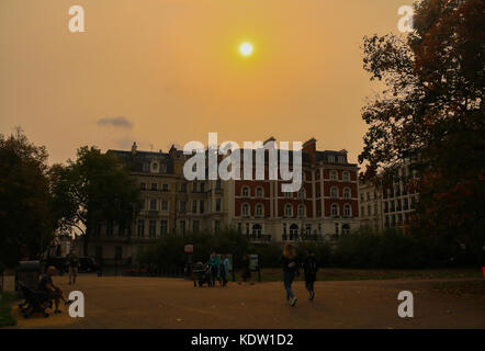 London, UK. 16th Oct, 2017. The sky turns an orange red bright about by the former hurricane Ophelia which is is pulling air and dust up from southern Europe and the African Sahara. Credit: amer ghazzal/Alamy Live News Stock Photo