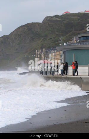 Aberystwyth, Ceredigion, Wales, UK  - High tide arrives with Storm Ophelia offshore across the Irish Sea - waves crash into the new bandstand on the seafront promenade - strong winds at Aberystwyth on the West Wales coast as Storm Ophelia approaches off the Irish Sea with local winds exceeding 60mph. Photo Steven May / Alamy Live News Stock Photo