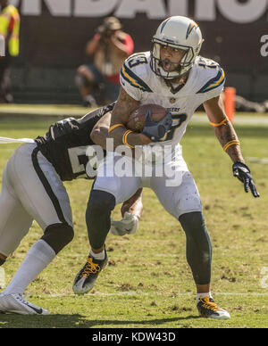 Oakland, California, USA. 15th Oct, 2017. Oakland Raiders cornerback David Amerson (29) tackles Los Angeles Chargers wide receiver Keenan Allen (13) on Sunday, October 15, 2017, at Oakland-Alameda County Coliseum in Oakland, California. The Chargers defeated the Raiders 17-16. Al Golub/CSM/Alamy Live News Stock Photo