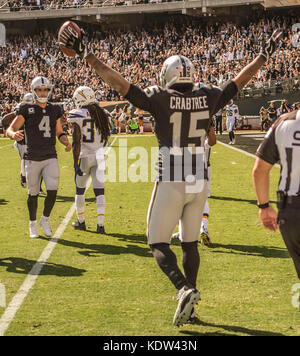 Oakland, California, USA. 15th Oct, 2017. Oakland Raiders wide receiver Michael Crabtree (15) celebrates touchdown on Sunday, October 15, 2017, at Oakland-Alameda County Coliseum in Oakland, California. The Chargers defeated the Raiders 17-16. Al Golub/CSM/Alamy Live News Stock Photo