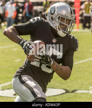 Oakland, California, USA. 15th Oct, 2017. Oakland Raiders wide receiver Michael Crabtree (15) makes touchdown run on Sunday, October 15, 2017, at Oakland-Alameda County Coliseum in Oakland, California. The Chargers defeated the Raiders 17-16. Al Golub/CSM/Alamy Live News Stock Photo