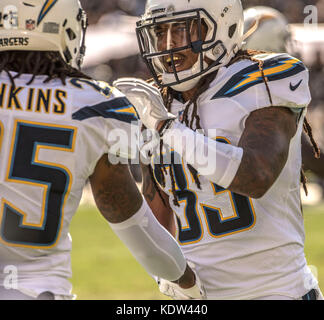 Oakland, California, USA. 15th Oct, 2017. Los Angeles Chargers free safety Tre Boston (33) congratulates safety Rayshawn Jenkins (25) on tackle on Sunday, October 15, 2017, at Oakland-Alameda County Coliseum in Oakland, California. The Chargers defeated the Raiders 17-16. Al Golub/CSM/Alamy Live News Stock Photo