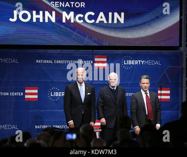 Philadelphia, PA, USA. 16th Oct, 2017. Senator John McCain, Vice President Joe Biden and National Constitution Center President and CEO Jeffrey Rosen pictured during the National Anthem before John McCain receives the 2017 Liberty Medal from Vice President Joe Biden at the National Constitution Center in Philadelphia, Pa on October 16, 2017 Credit: Star Shooter/Media Punch/Alamy Live News Stock Photo