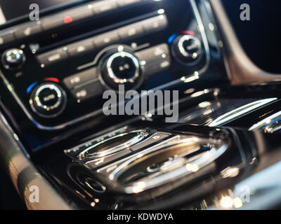 Central console of luxury car.  Attention: very shallow depth of field. Stock Photo
