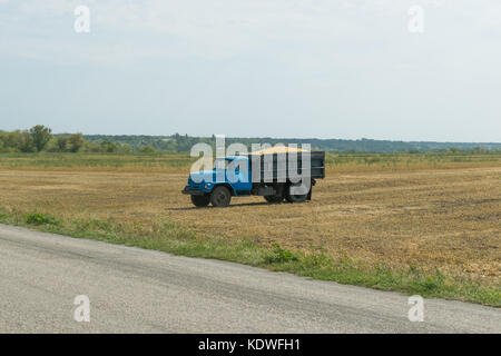 Old truck carrying soybeans in the fields Stock Photo