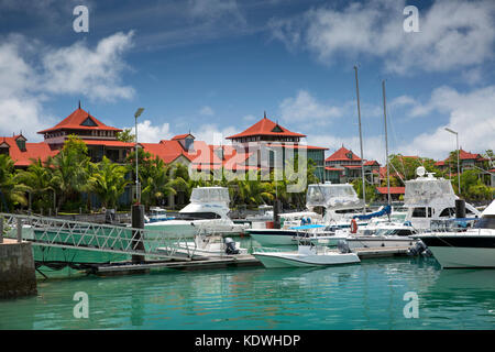 The Seychelles, Mahe, Victoria, Eden Island, housing on reclaimed land and boats moored in marina Stock Photo