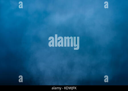 Abstract white water vapor on a blue background. Texture. Design elements. Stock Photo